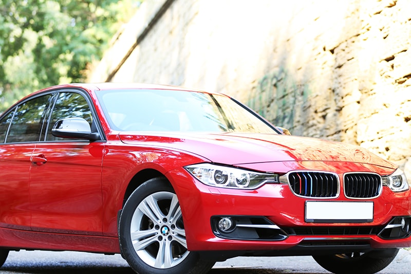 A red sedan vehicle