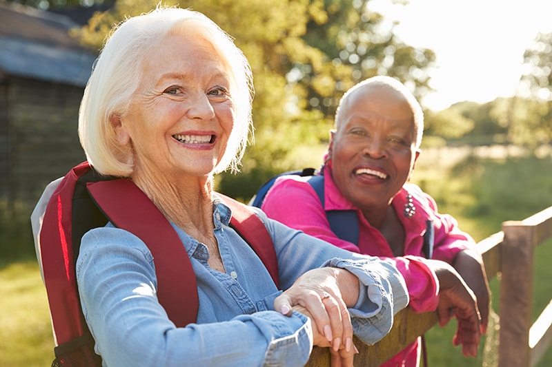 Two senior women on a nature walk