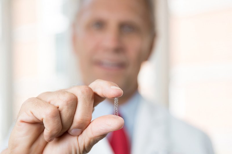Dr. Stuckey holds stent